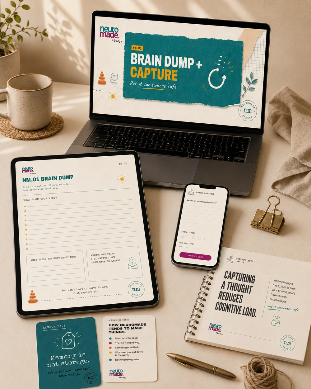Warm creative desk with laptop, tablet, phone and paper views of the Brain Dump and Capture System